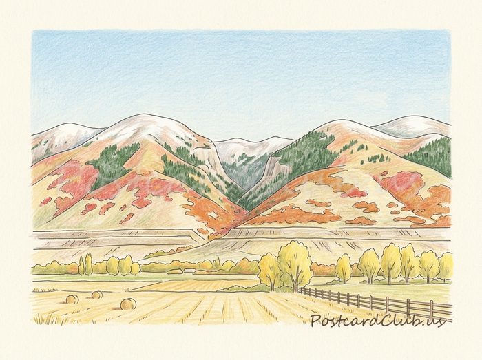 Fall colors: Red and orange leaves on the mountainsides.